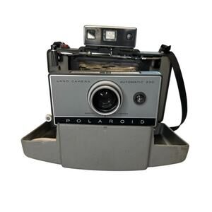 Polaroid Automatic 230 Land Camera, leather case, flash bulb, extra parts, picts